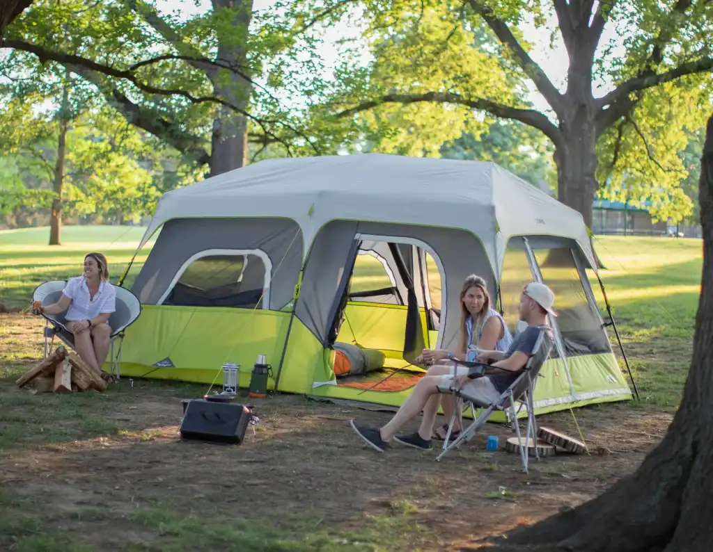 Best Family Camping Tents 2025: Medium Price Range 5 Family enjoying outdoor camping with a spacious tent in a scenic park.